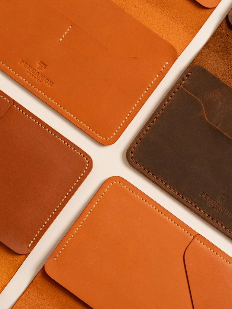 Vegetable-tanned hides dry on wooden racks at Conceria Walpier.